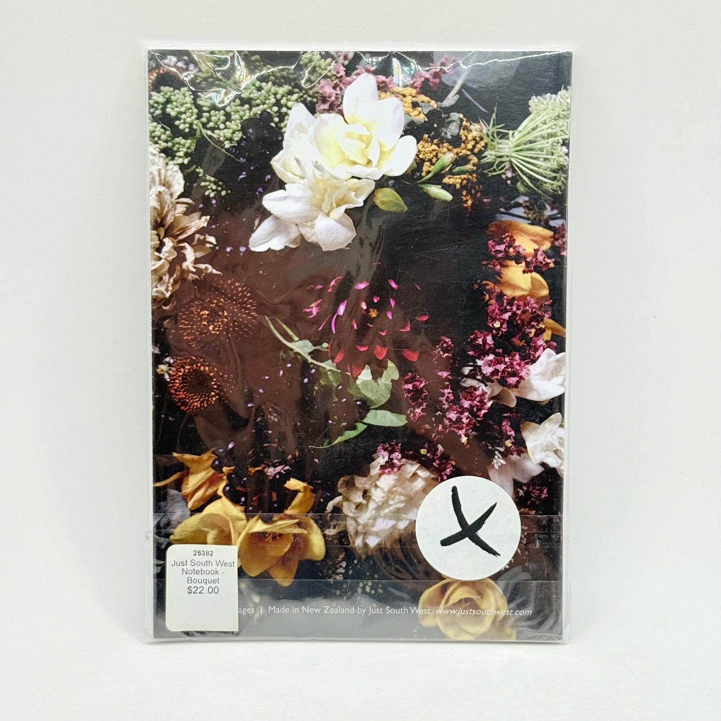 A floral-themed notebook or journal with a dark background.