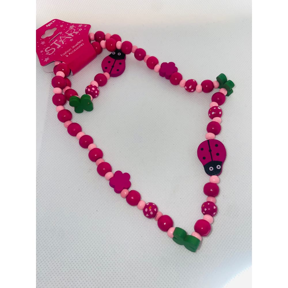 Kids’ pink ladybug and flower wooden beaded necklace - necklaces fashion accessories