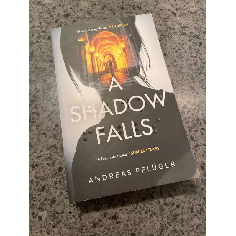 A shadow falls - andreas pfluger - print books book - fiction - fiction book - thriller printed media