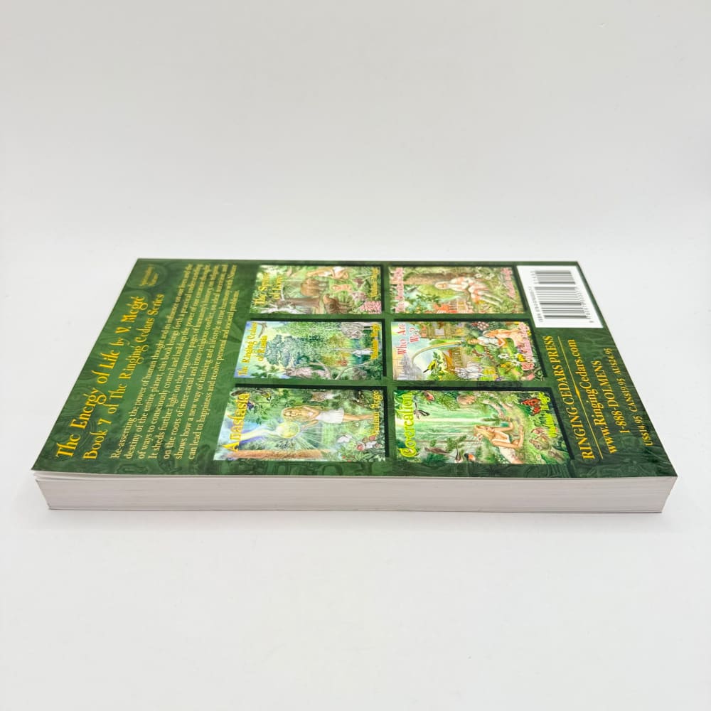A green-covered book with a collage of nature scenes on the back cover.