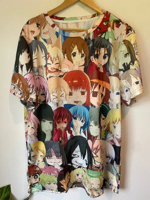 A white t-shirt featuring a colorful, all-over print of various anime girl faces.