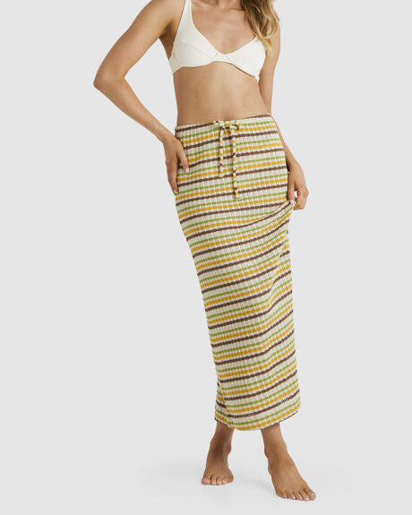 A women’s long, striped, knitted skirt with a drawstring waist.