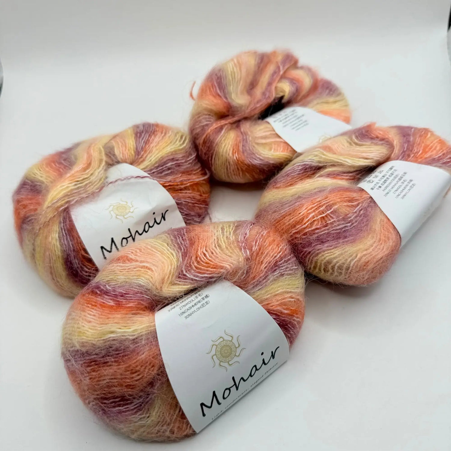 Four skeins of soft, multicolored mohair yarn.