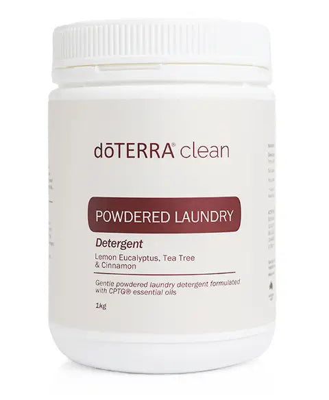 White plastic tub of dōTERRA clean powdered laundry detergent.