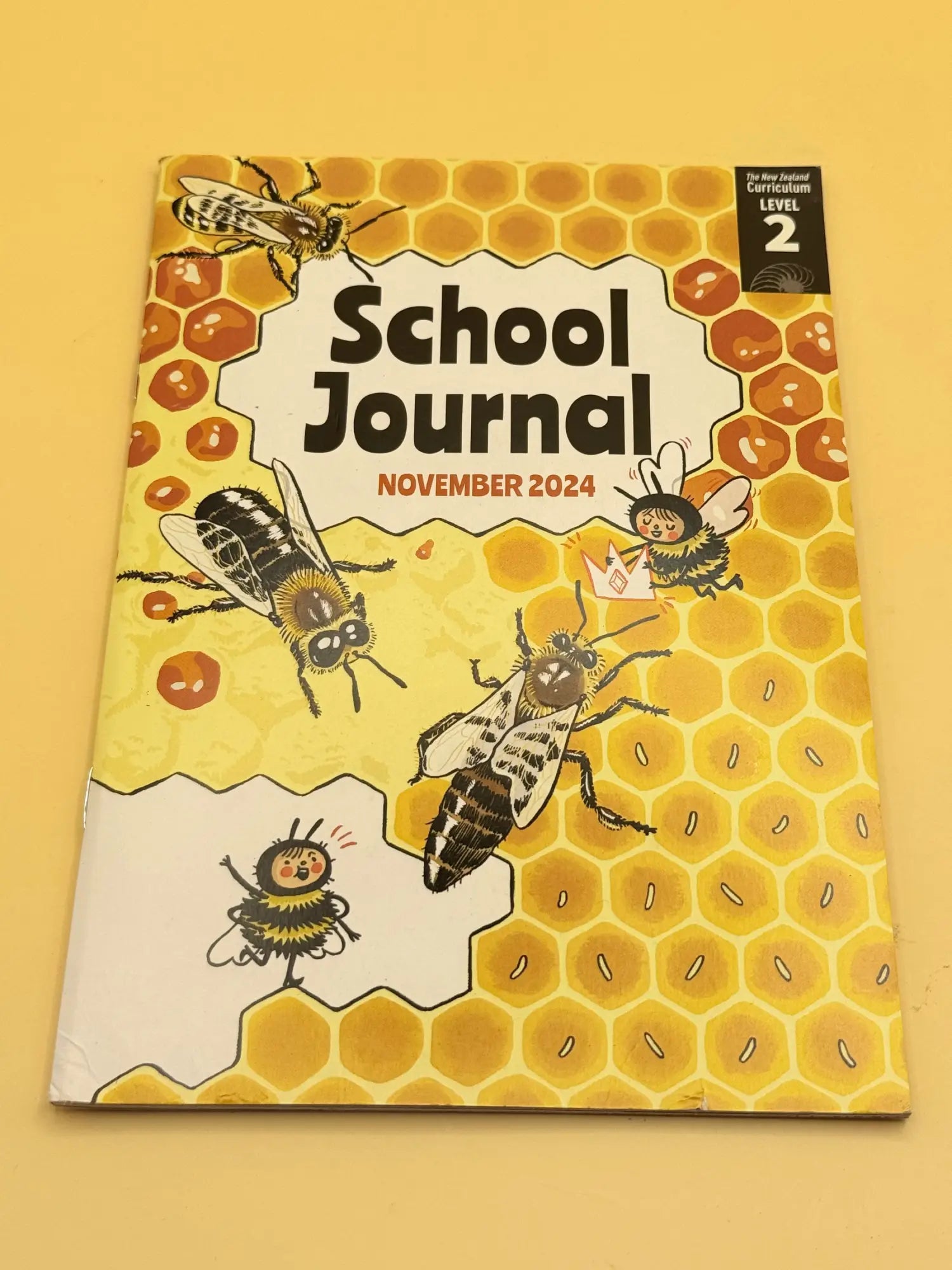 A children’s educational journal with a bee and honeycomb-themed cover.