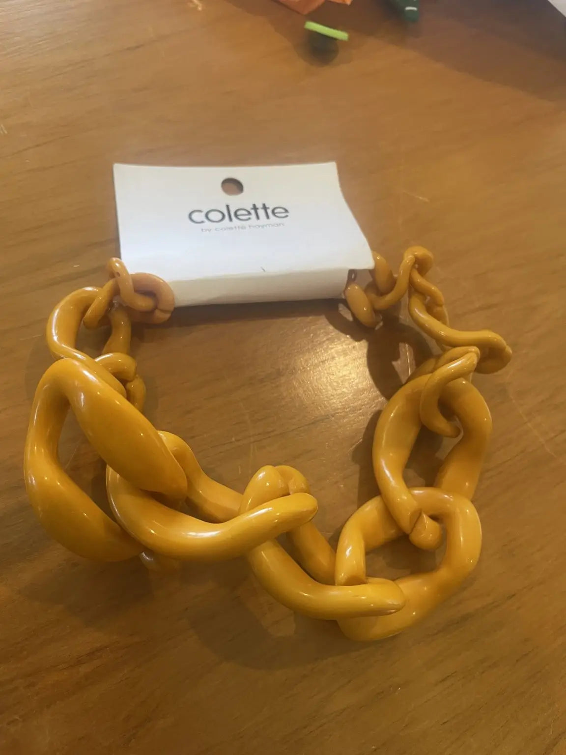 A chunky yellow resin chain necklace.