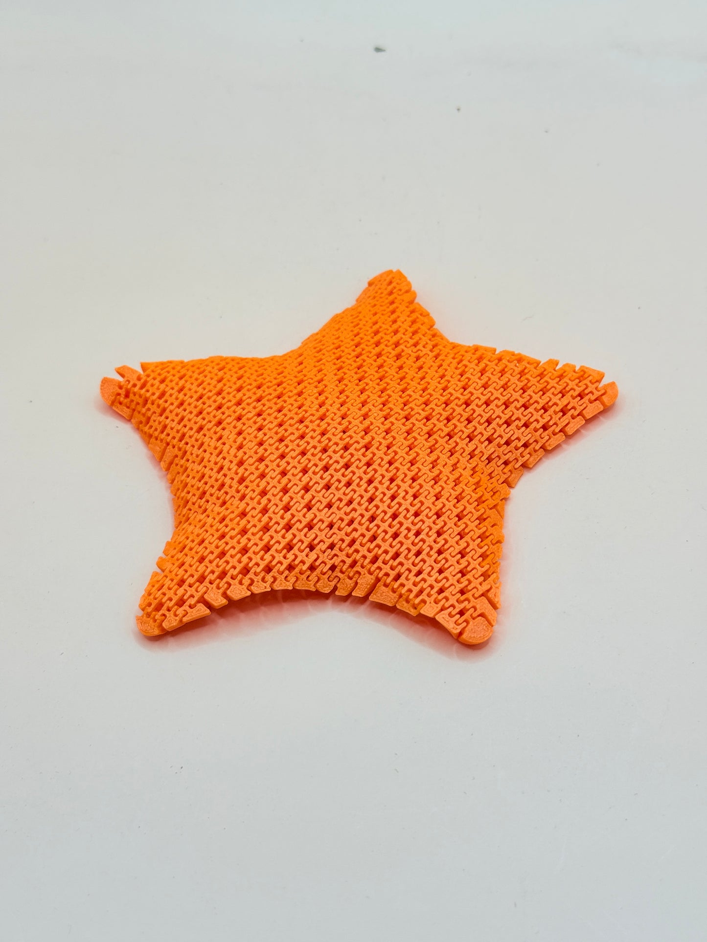 3D Printed Orange Flexible Fidget Star Toy