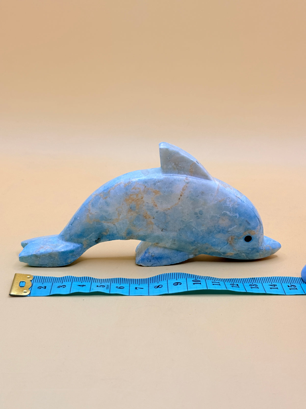 Assorted stone-look dolphin ornament - one random colour