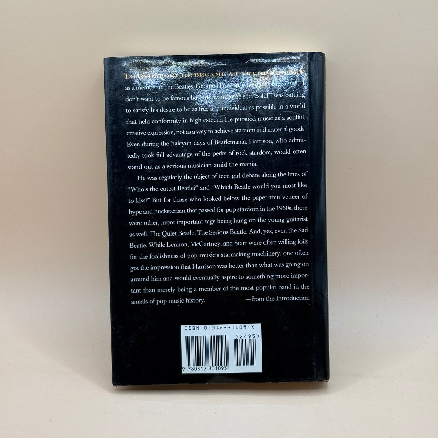 Behind Sad Eyes: The Life of George Harrison by Marc Shapiro