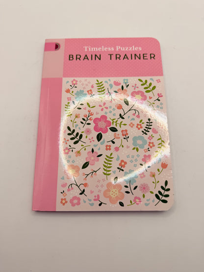 Timeless puzzles: brain trainer by publications international - print books printed media