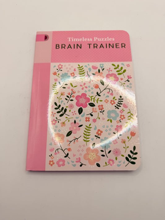 Timeless puzzles: brain trainer by publications international - print books printed media