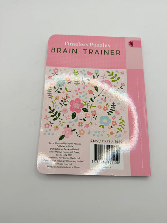 Timeless puzzles: brain trainer by publications international - print books printed media