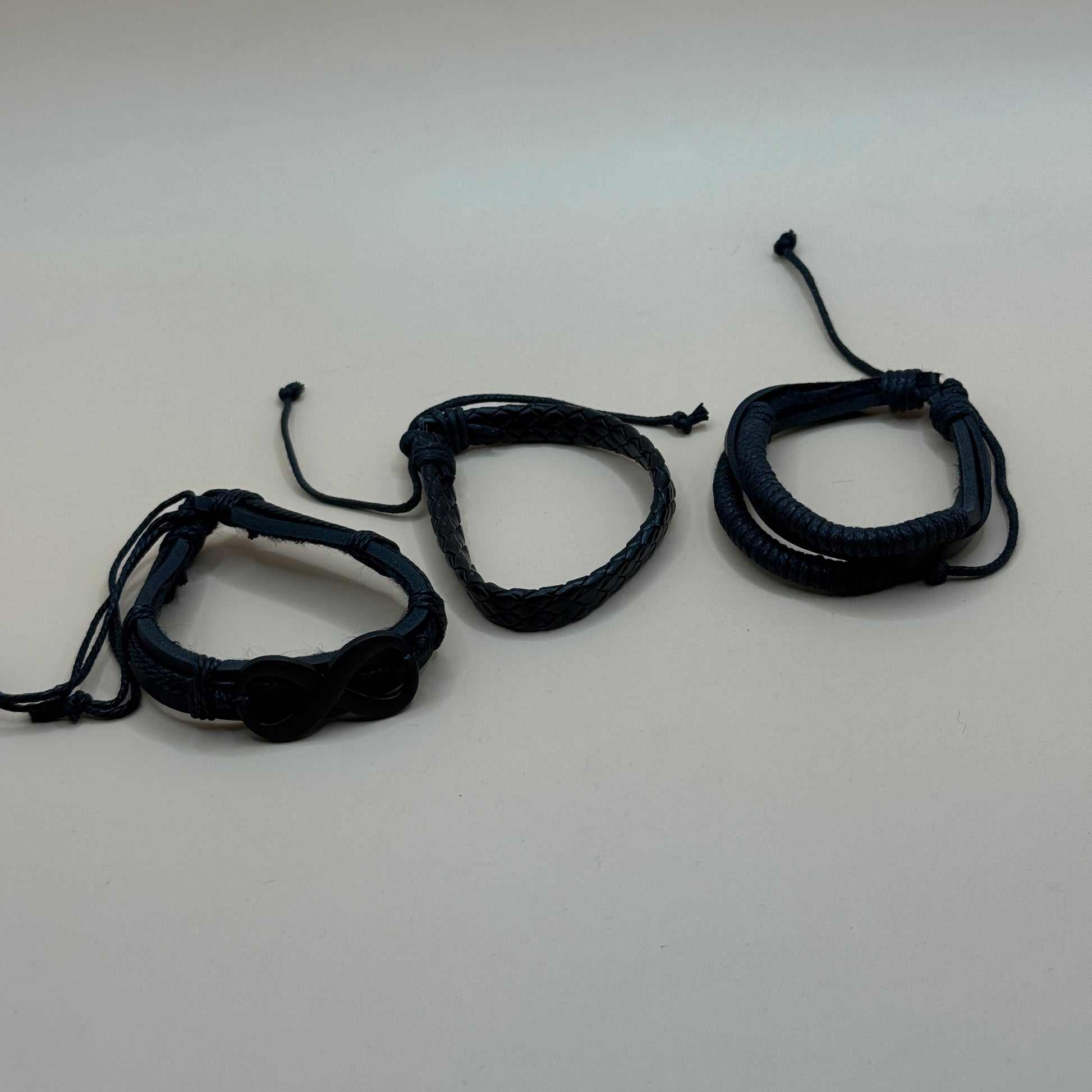Brand Unknown Brand Unknown Black Braided Leather And Cord Adjustable Bracelets. Manual Content