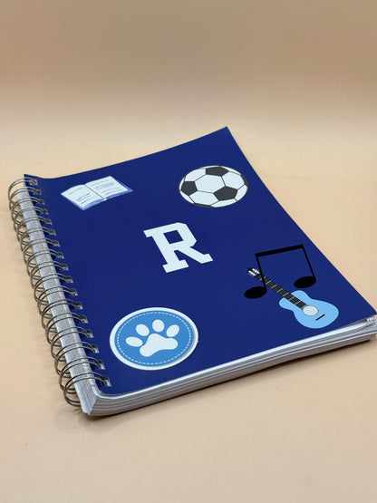 “R” Blue Spiral Notebook with Sports & Music Design