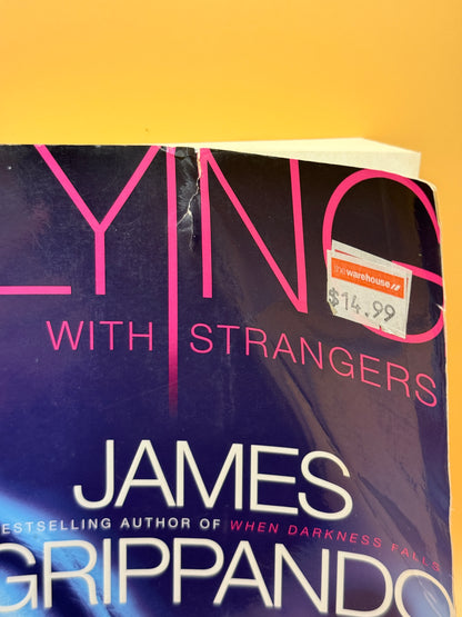 Lying with Strangers by James Grippando