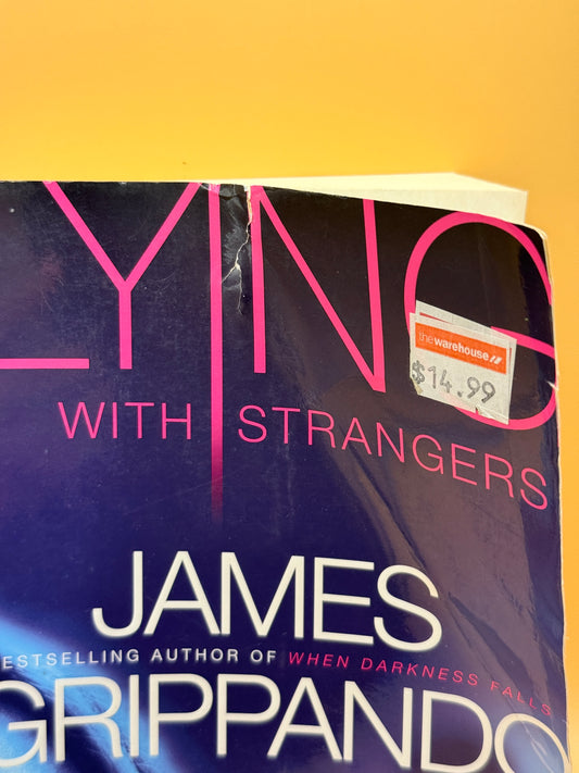 Lying with Strangers by James Grippando