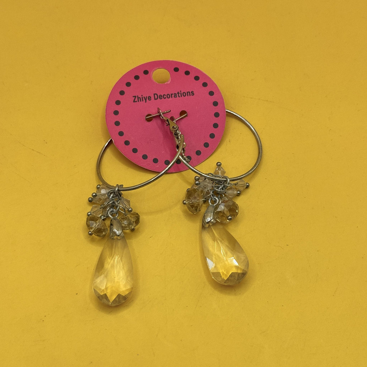 Silver Tone Hoop Earrings with Crystal Teardrop Drops