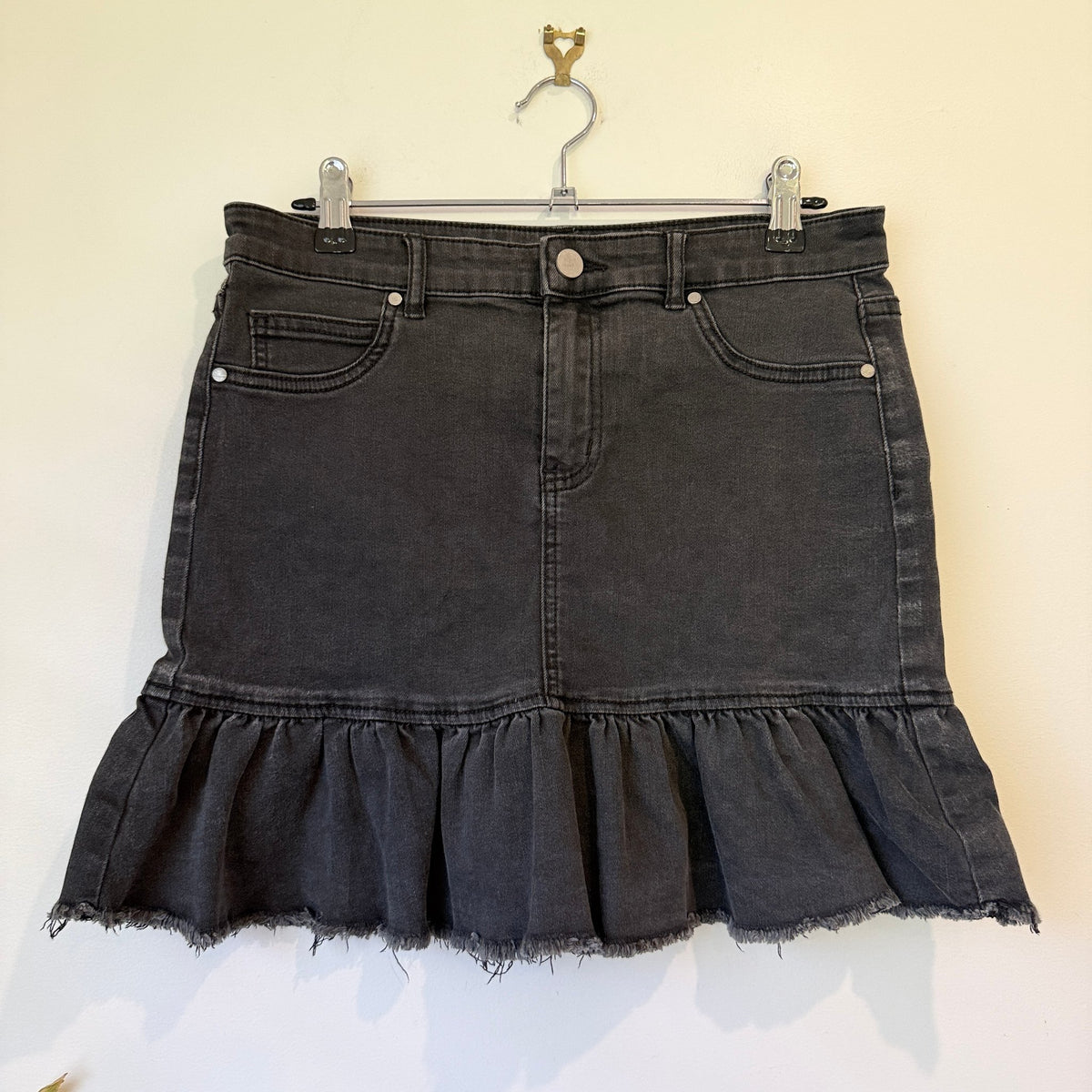 Washed Black Denim Mini Skirt with Ruffle Raw Hem