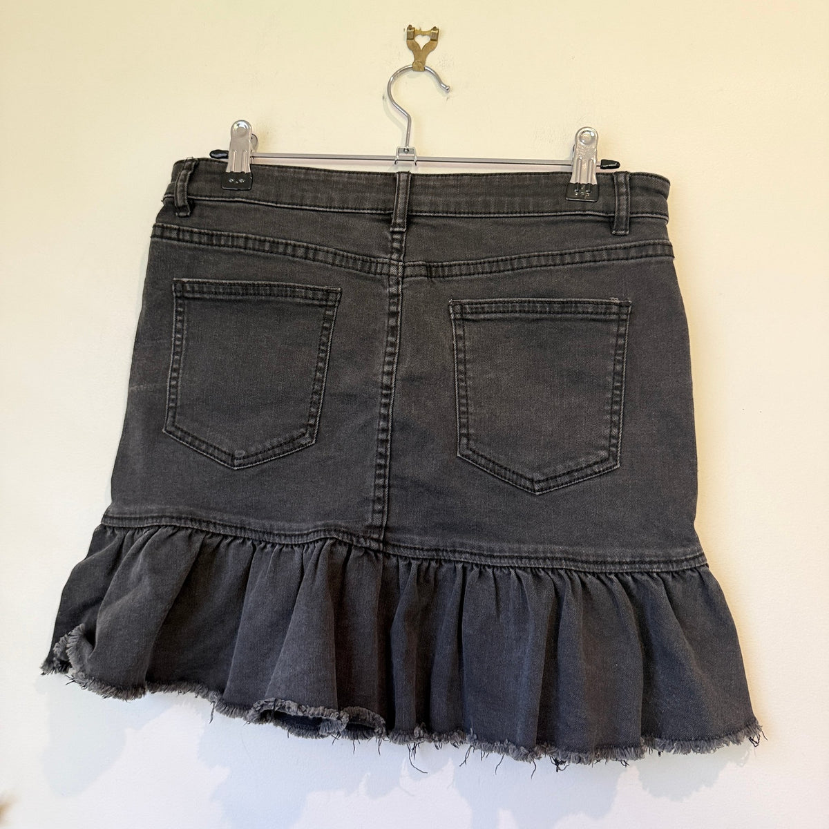Washed Black Denim Mini Skirt with Ruffle Raw Hem