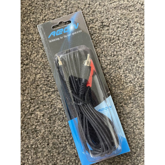 Packaged RCA audio cable on carpet.