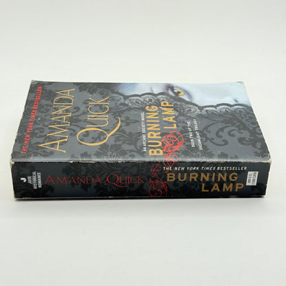 Burning lamp by amanda quick - print books condition: used - what’s new printed media