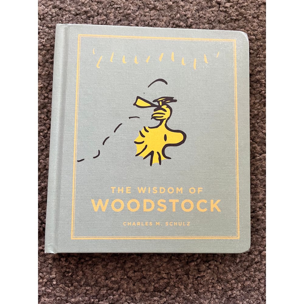 The wisdom of woodstock by charles m. Schulz - print books printed media