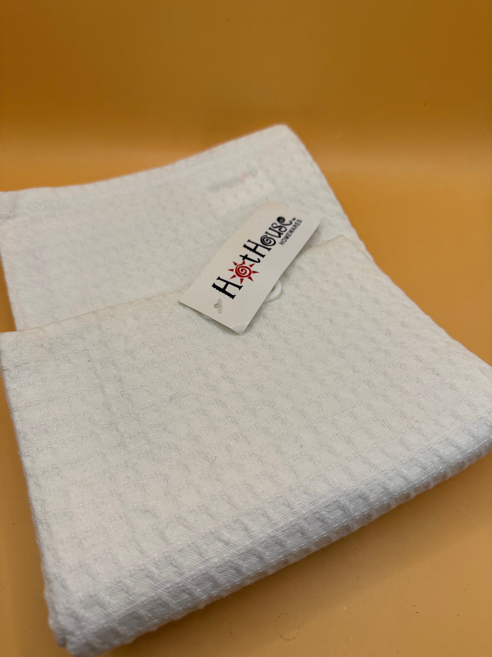Hot House Homewares brand tag on white tea towel