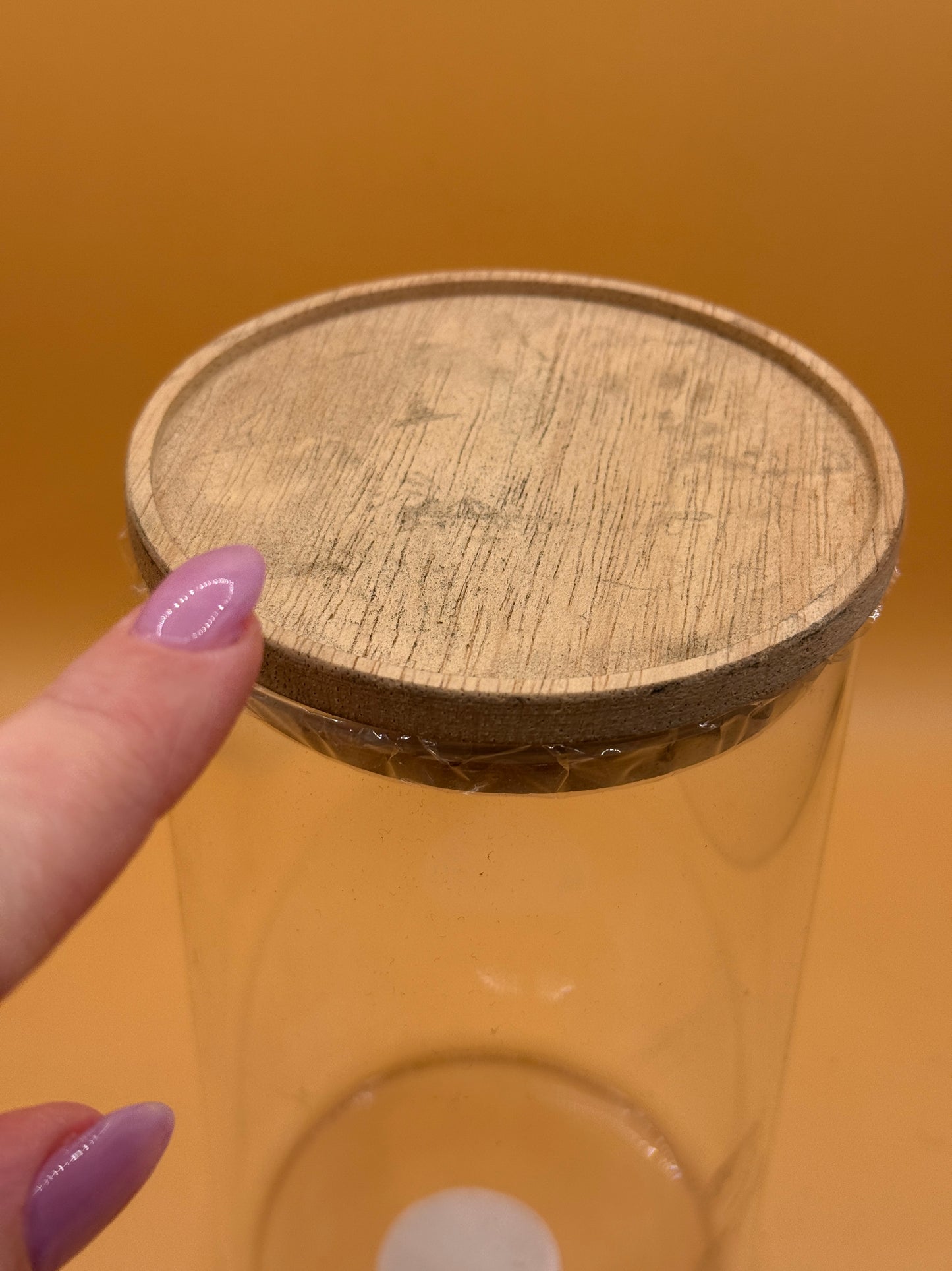 Natural finish lid detail on large glass canister