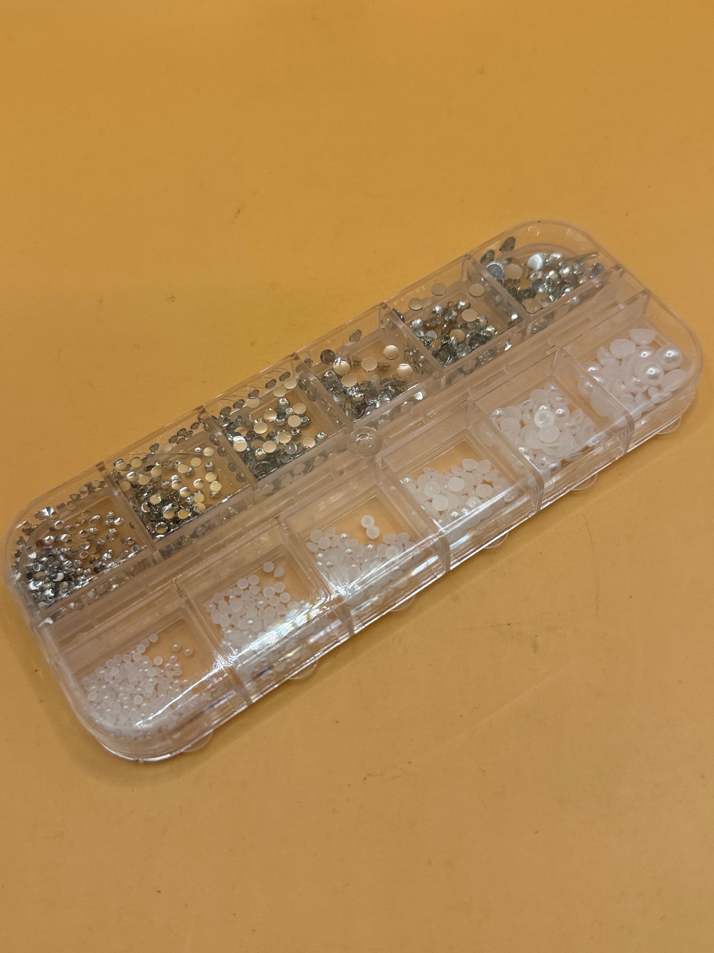 Mixed rhinestones and half pearls in 12-compartment storage case