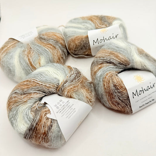 Four skeins of soft, multi-colored mohair yarn.