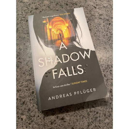 A shadow falls - andreas pfluger - print books book - fiction - fiction book - thriller printed media