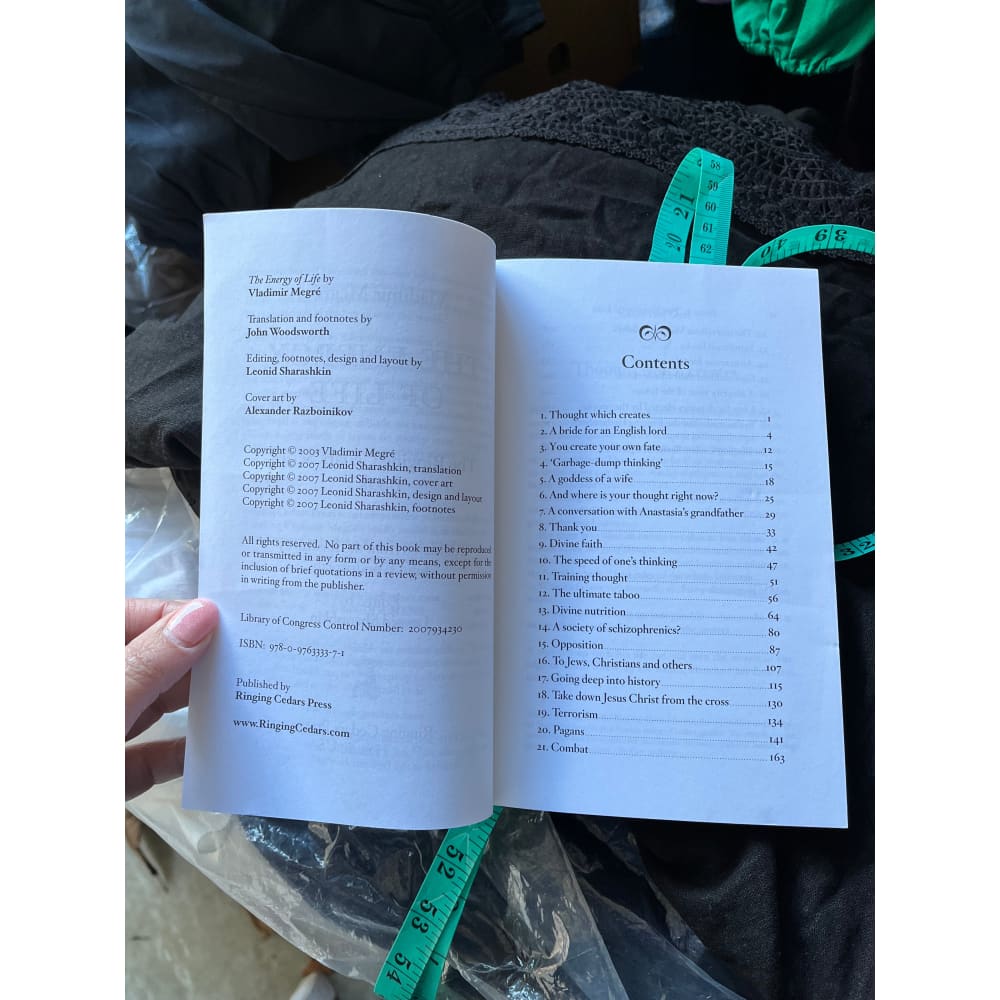 An open paperback book displaying its title page and table of contents.